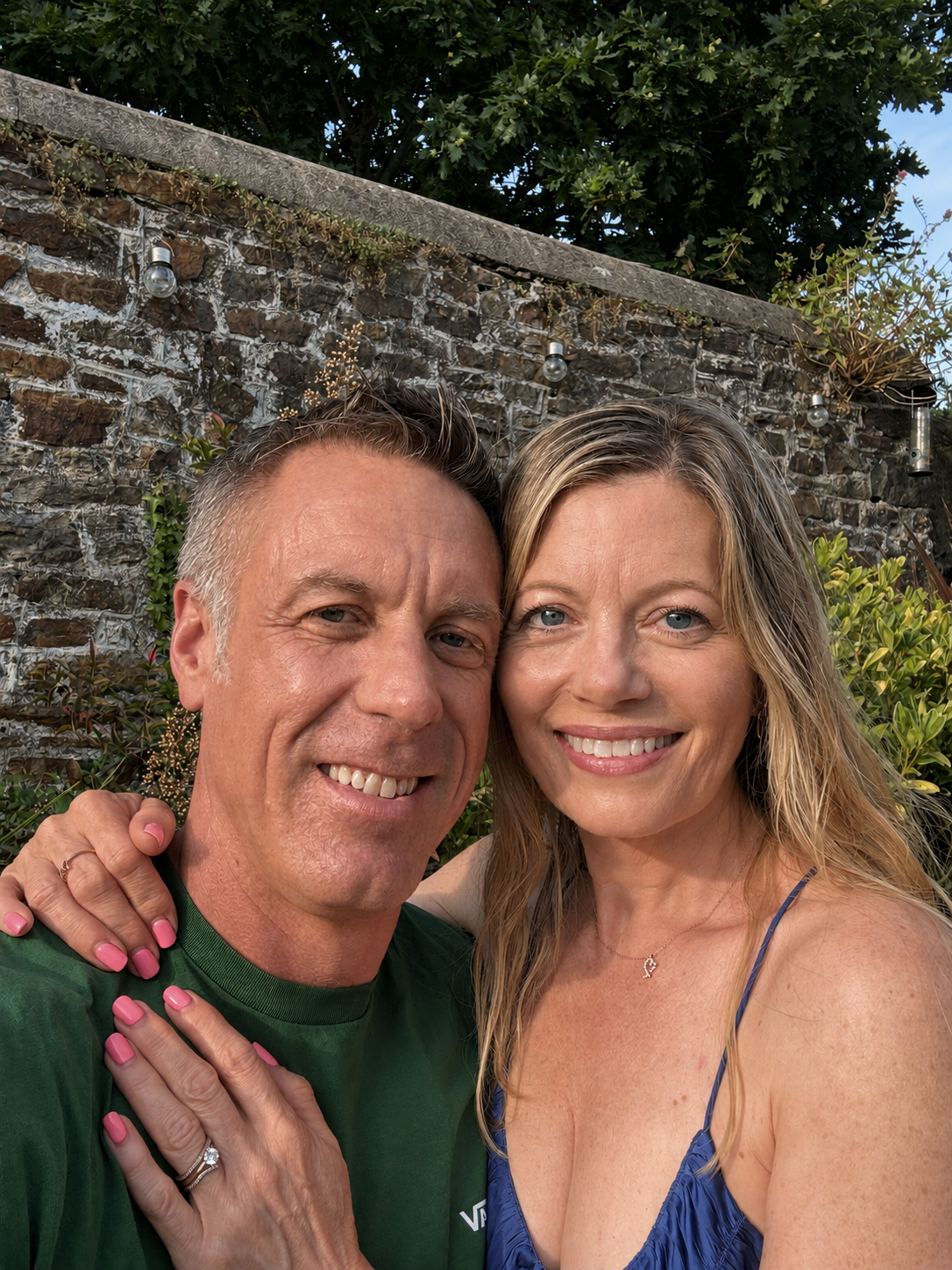 The two facilitators smiling together outdoors
